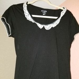 Black shirt, white collar/lace detail. Hot topic